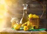 alcohol quince liqueur sliced fruit prepare wooden setting  Plakaty do kuchni Plakat