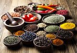 Spices on wooden bowl background   Obrazy do Kuchni  Obraz