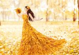 Autumn woman in fashion dress of fall maple leaves, artistic  Ludzie Obraz