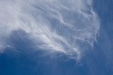 Wispy High Cirrus Clouds in a Blue Sky  Niebo Fototapeta
