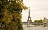 View of the Eiffel tower, moving subway train autumn trees  Fototapety Wieża Eiffla Fototapeta