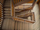 Wooden staircase in building  Schody Fototapeta