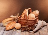 Different bread on table on brown background  Obrazy do Jadalni Obraz