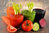 Glasses with fresh organic vegetable juices on wooden table  Obrazy do Kuchni  Obraz