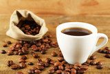 Cup of coffee with beans on rustic wooden background  Obrazy do Kuchni  Obraz