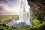 Seljalandsfoss, Iceland - Passage under the waterfall with rainb Fototapety Wodospad Fototapeta