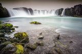 Godafoss, Iceland - Looking up at huge waterfall with rocks in t Fototapety Wodospad Fototapeta