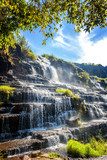 Beautiful bright landscape with waterfall and green trees Fototapety Wodospad Fototapeta