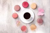 Cup of coffee with macarons and paper butterfly Fototapety Pastele Fototapeta