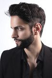 Side view portrait of  stylish young man wth a modern hairstyle  Obrazy do Salonu Fryzjerskiego Obraz