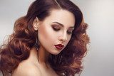 Fashion beauty portrait of a beautiful girl with curly hair luxuriant Obrazy do Salonu Fryzjerskiego Obraz