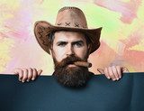 Bearded brutal caucasian hipster cowboy Obrazy do Salonu Fryzjerskiego Obraz