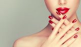 Beautiful girl showing red  manicure nails . makeup and cosmetics Obrazy do Salonu Kosmetycznego Obraz