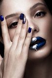Beautiful girl with art make-up, dark glitter lips design and manicured nails. beauty face. Photos shot in studio Obrazy do Salonu Kosmetycznego Obraz