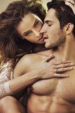 Sensual woman touching her boyfriend's perfect body  Ludzie Plakat