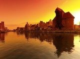 Sunset cityscape with vibrant colors. Gdansk, Poland.  Zachód Słońca Fototapeta
