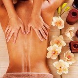 Masseur doing massage on woman back in spa salon  Obrazy do Salonu SPA Obraz