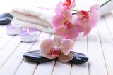 Still life with beautiful blooming orchid flower, towel and spa  Kwiaty Obraz