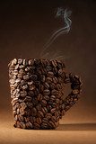 Cup of coffee beans with smoke on brown background  Fototapety do Kawiarni Fototapeta
