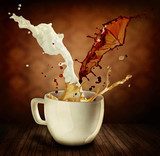 Coffee With Milk Splashing. Cup of Cappuccino or Latte  Fototapety do Kawiarni Fototapeta