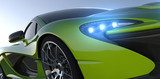 green sportcar closeup  Pojazdy Obraz