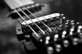 Strings electric guitar closeup in black tones  Muzyka Obraz