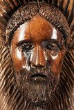Carved face in the wood  Religijne Obraz