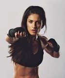Hispanic female practicing boxing  Fototapety do Klubu Fitness Fototapeta