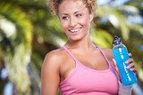 Portrait of woman drinking water outdoor  Fototapety do Klubu Fitness Fototapeta