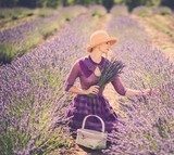 Woman in purple dress and hat with basket in lavender field  Prowansja Fototapeta
