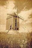 Old wooden windmill. vintage image of old buildings  Fototapety Sepia Fototapeta