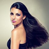 Beautiful brunette with long hair flying  Obrazy do Salonu Kosmetycznego Obraz