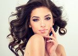 Beautiful girl light brown hair with an elegant hairstyle , hair wave ,curly hairstyle Fototapety do Salonu Fryzjerskiego Fototapeta