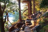 Beautiful Wisconsin summer nature background. Ice age hiking trail and stone stairs in sunlight during sunset hours. Devil's Lake State Park, Baraboo area, Wisconsin, Midwest USA. Optycznie Powiększające Fototapeta