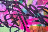 Colorful green, pink and black urban wall texture. Modern pattern for wallpaper design Creative modern urban city background for advertising mockups. Grunge messy street style new wave background Fototapety Graffiti Fototapeta