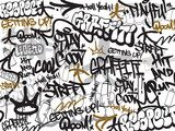 Czarno-złote napisy graffiti w dynamicznej kompozycji Fototapety Graffiti Fototapeta