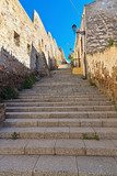 stairway and ancient walls in Carloforte  Schody Fototapeta