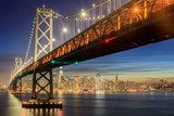 Western Span of San Francisco-Oakland Bay Bridge and San Francisco Waterfront in Blue Hour. Shot from Yerba Buena Island, San Francisco, California, USA. Mosty Obraz