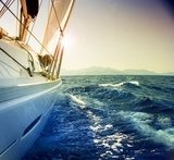 Yacht Sailing against sunsetSailboatSepia toned Plakaty do Biura Plakat
