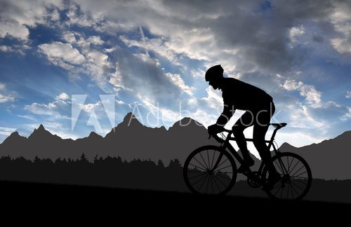 silhouette of the cyclist riding a road bike at sunset  Sport Fototapeta