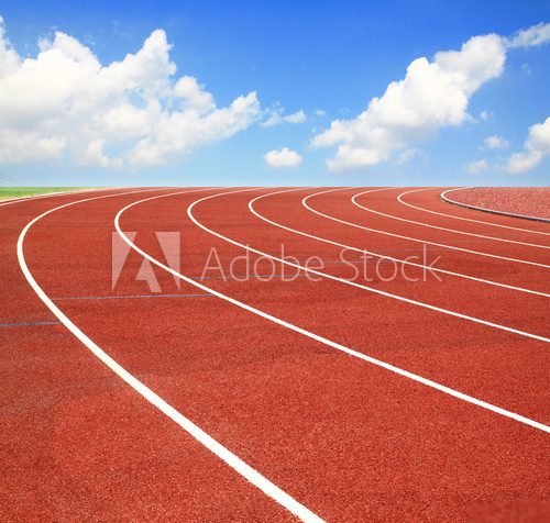 Running track with lanes over sky and clouds  Stadion Fototapeta