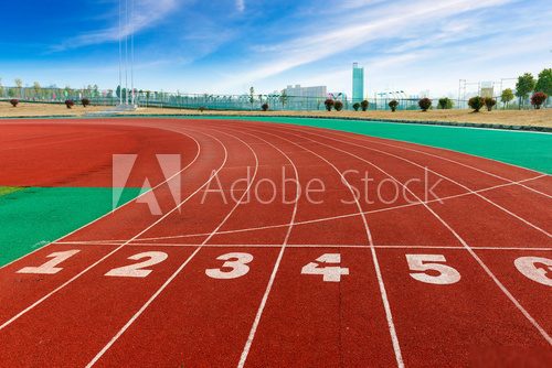 red plastic runway and numbers in a sports ground  Stadion Fototapeta