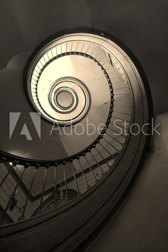 Kręta droga życia. Spiralne schody. Schody Fototapeta