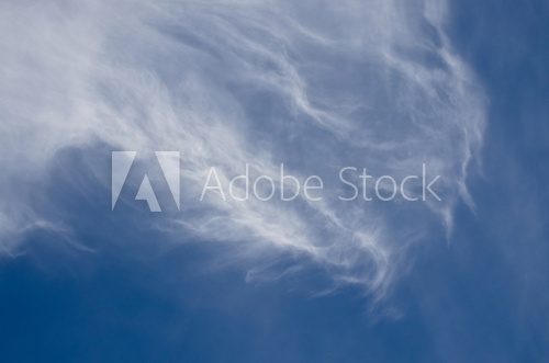 Wispy High Cirrus Clouds in a Blue Sky  Niebo Fototapeta