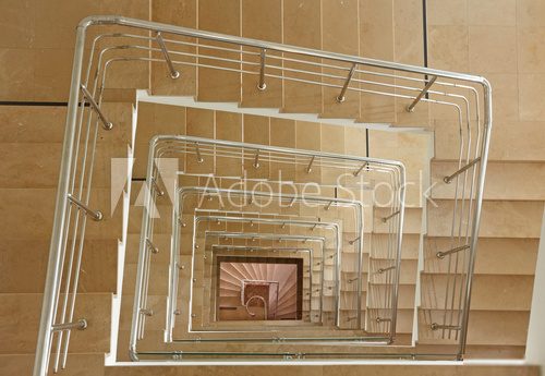 Indoor stairway in square spiral  Schody Fototapeta