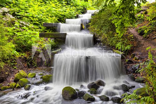 Cascade waterfall in Planten un Blomen park in Hamburg  Fototapety Wodospad Fototapeta