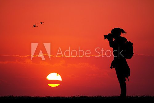girl photographer at sunset  Ludzie Plakat