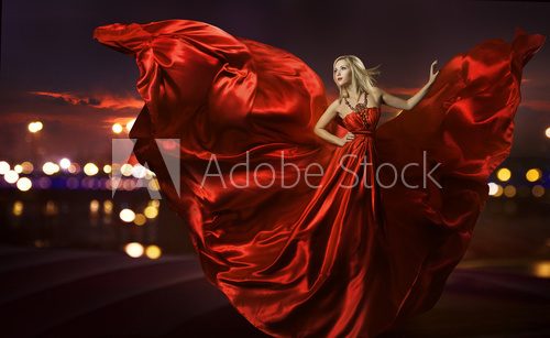 woman dancing in silk dress, artistic red blowing gown waving  Ludzie Plakat
