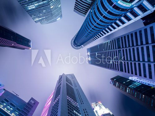 Skysrapers in Singapore during night hours  Architektura Plakat