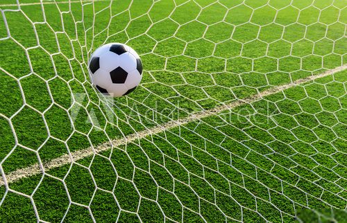 soccer ball in goal net  Stadion Fototapeta